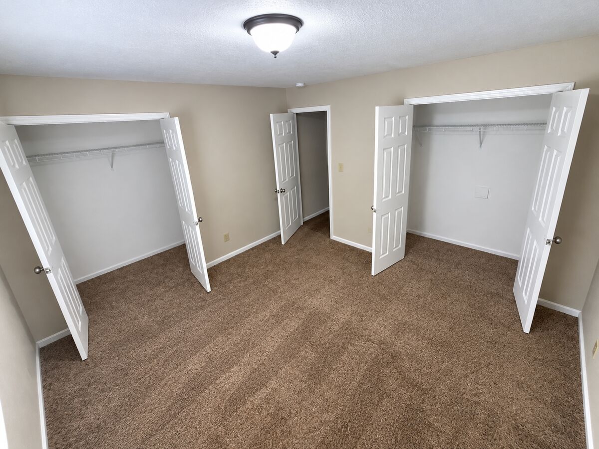 Closets in the first bedroom of a 2-bedroom townhome at Canterbury Station
