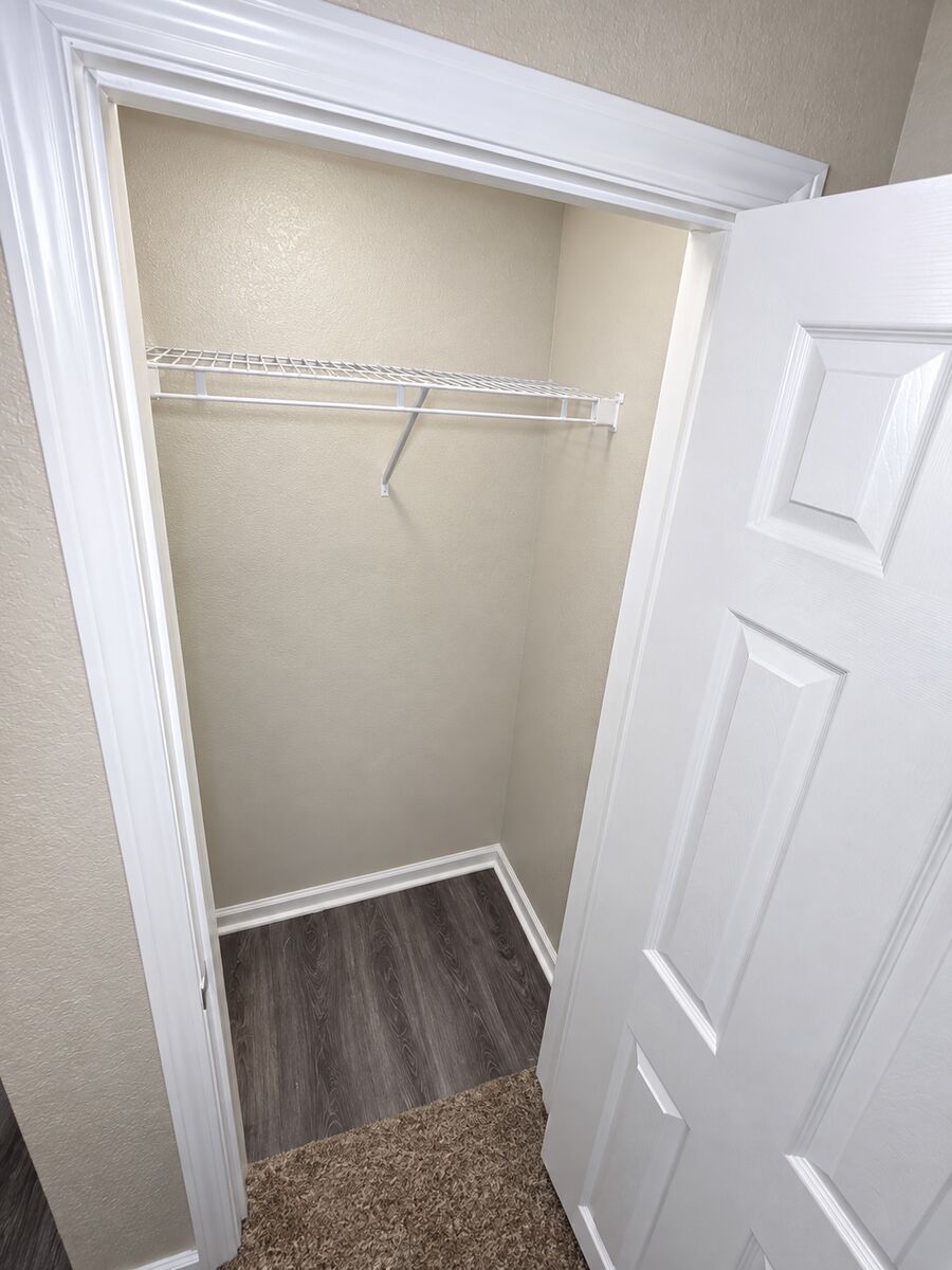 Second bedroom closet in a 2-bedroom townhome at Canterbury Station